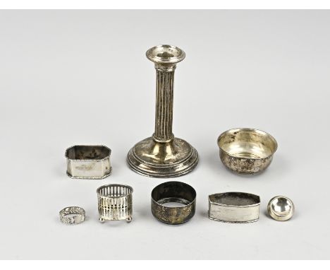 Lot of various silver, with a candlestick, napkin bands, bowl and holders. approx. 324 grams. Various levels. In decent shape