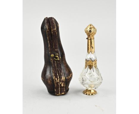 Crystal odor flacon with gold, 585/000, in cassette. Bottle, belly model, placed on a gold base and decorated with gold rim, 