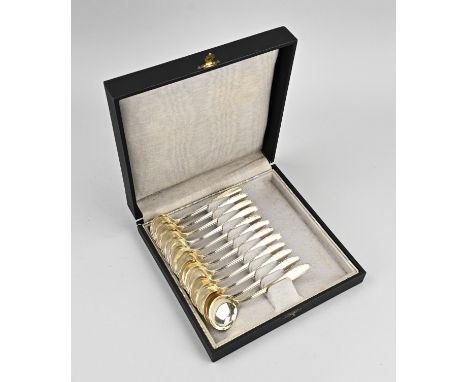 Cassette containing 12 silver-plated ice cream scoops, WMF 100-1.5. with a round bowl and a handle in baroque style. 14 cm. I