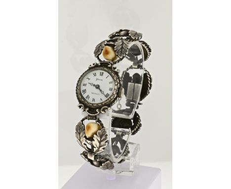 Silver watch, 835/000, round model with a mechanical watch with a white dial. The round links decorated with leaves and acorn