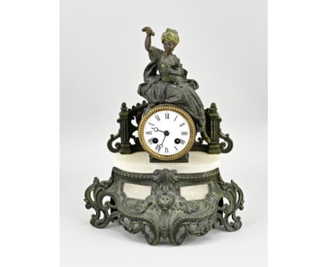 Antique French Louis Philippe mantel clock made of composition metal and alabaster. Circa 1870. Eight-day movement, half-hour