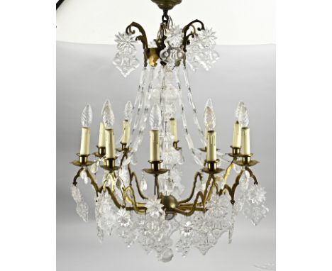Antique 9-light brass chandelier with crystal glass drops. Circa 1900. Dimensions: 90 x 60 cm. In good condition.