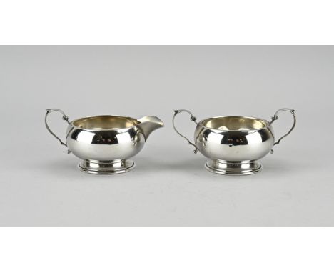 Silver cream set, 925/000, with a milk jug and a sugar bowl. Round model on a round base with fillet edge. The handles are de