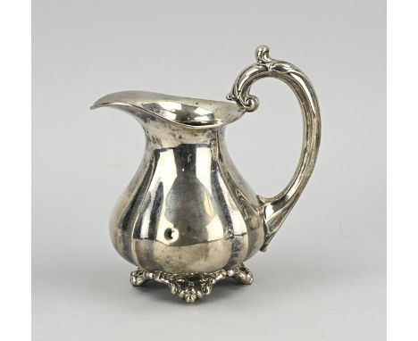 Silver milk jug, 833/000, model with ribs and placed on decorated legs. The handle is decorated with acanthus leaves. MT.: JM