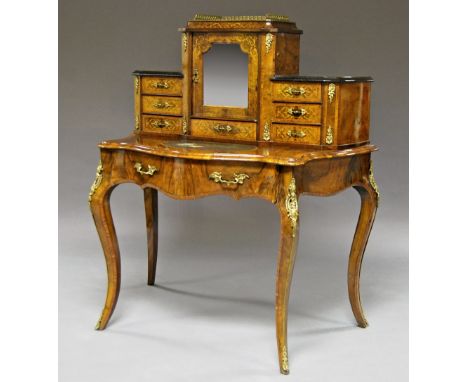 A French ormolu and inlaid walnut bonheur de jour, with gallery above superstructure consisting of central cabinet with mirro