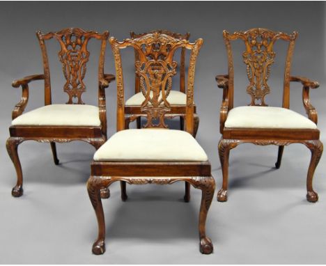 A set of eight Chippendale style dining chairs, 19th century, the carved foliate back splat with scrolling arms, raised on ca