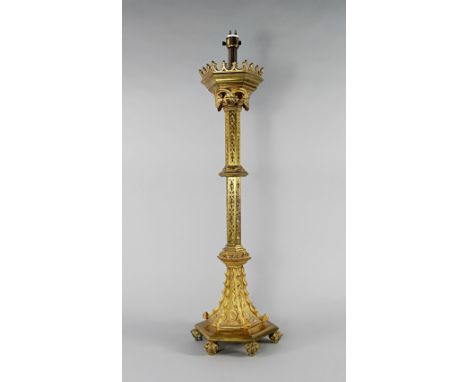 A Gothic taste gilt metal ecclesiastical candlestick, late 19th/20th century, overall decorated with trailing ivy leaves and 