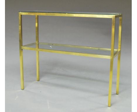 A rectangular gilt metal and glass rectangular side table, in the manner of Pierre Vandel, with two tiers, on square section 