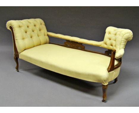 An Edwardian mahogany chaise lounge, early 20th century, scroll arm with cream upholstery with button back arms and rail, rai