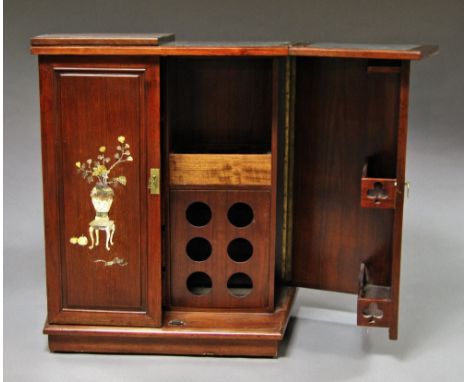 A Chinese hardwood mother of pearl inlaid bar, 20th century, the folding marble inlaid top above two inlaid cupboard doors, f