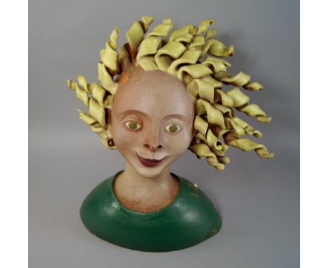 Tessa Fuchs, British 1936-2012, earthenware portrait bust of a girl with curly blond hair, damages, 44cm high. (may be subjec