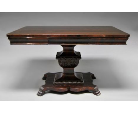 A William IV mahogany dining table, 19th century, the shaped rectangular top with frieze drawer, raised on carved pedestal, c