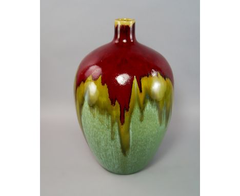 A large flambe glazed pottery vase, 20th century, of globular form covered in red and green lustre glazes, 40cm high CONDITIO
