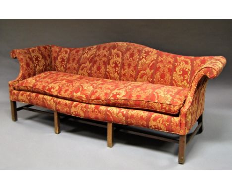 A George III style long scroll arm sofa, late 19th/early 20th century, the shaped back rail ending with scrolling arms, serpe