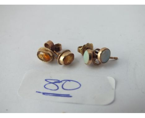 Two pairs of earrings - (1 opal &amp; 1 stone set) in 9ct 