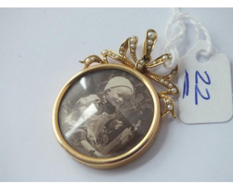 A pearl set double sided photo locket in 15ct gold 