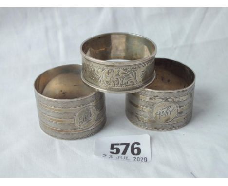 Pair of engine-turned napkin rings - Chester 1922 -  and another - 77gms