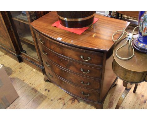 Mahogany bow front chest having brush slide above four long drawers on splayed bracket feet