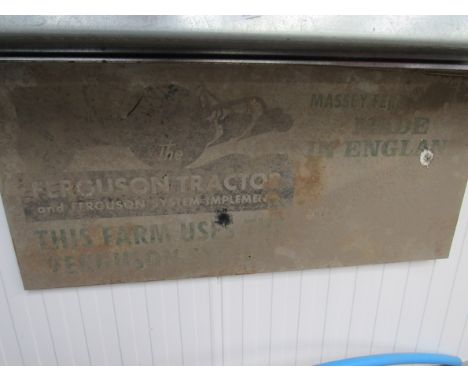 A tin sign 'The Ferguson Tractor and Ferguson system implements'. 41cm x 90cm