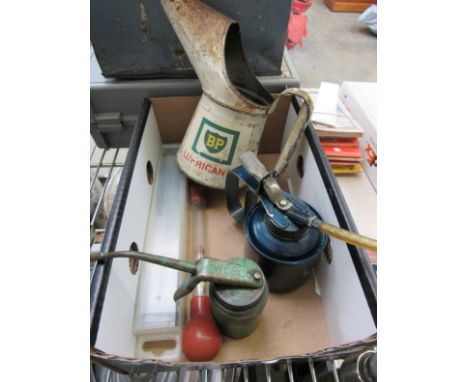 A box containing a BP oil jug, Wesco dispenser etc 