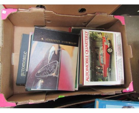 A box of automobile quarterly books 