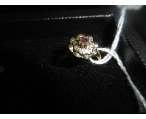 A 9CT RUBY AND DIAMOND RING, SIZE M
