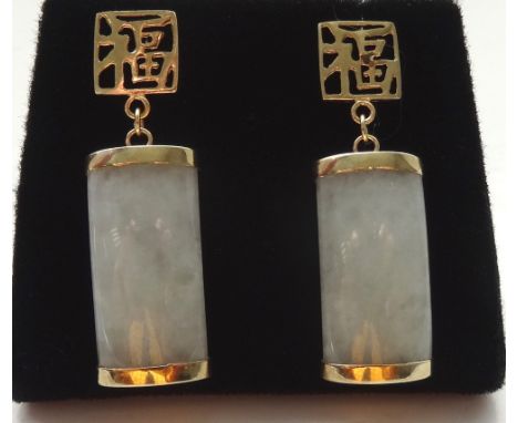 PAIR OF JADE DROP EARRINGSthe curved jade panels below pierced squares decorated with character marks, in nine carat gold