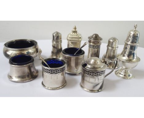 SELECTION OF GEORGE V AND LATER SILVER CONDIMENTSincluding a lidded mustard, salt and pepper pot, all with liners, Birmingham
