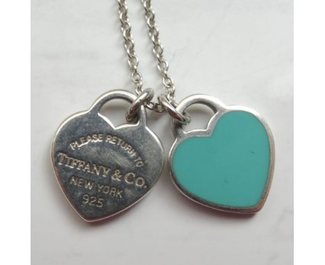 'TIFFANY & CO.' SILVER MINI DOUBLE HEART TAG PENDANTone tag engraved 'Please Return to Tiffany & Co. New York', the other wit