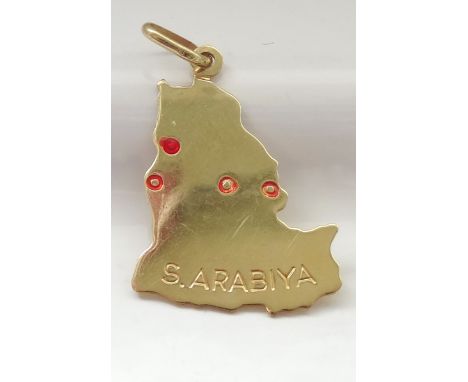 EIGHTEEN CARAT GOLD PENDANTin the form of Saudi Arabia and engraved 'S. Arabiya', approximately 2.2 grams