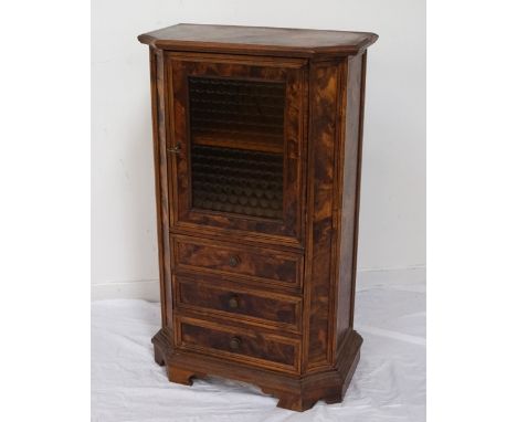 FRENCH WALNUT SIDE CABINETwith a shaped top above a yellow coloured glass honeycomb pattern door, opening to reveal two shelv