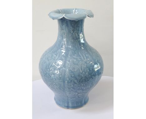 CHINESE PORCELAIN CLAIR-DE-LUNE GLAZED PORCELAIN VASEthe bottle shaped vase with flared lotus petal rim, with moulded floral 