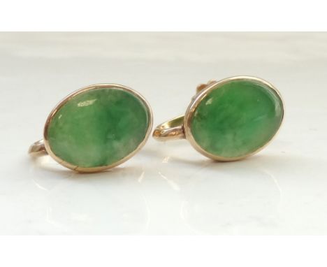 PAIR OF JADE EARRINGSin nine carat gold mounts with screw backs