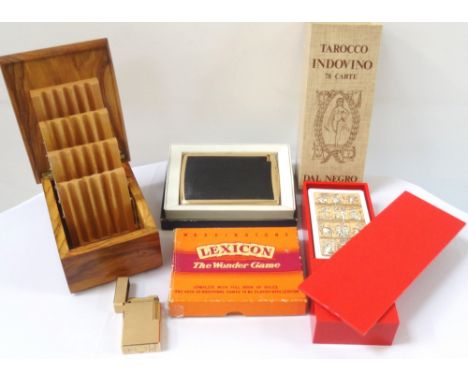 MIXED LOT OF COLLECTABLESincluding a teak cigarette box with four folding tiers, a metal combination cigarette case with inte