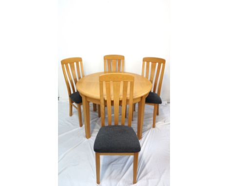 LIGHT OAK EXTENDING DINING TABLEwith a pull apart top revealing a fold out leaf, 115cm long (closed), standing on tapering su