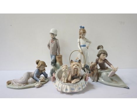LLADRO DOG GROUP 'OUR COZY HOME'12cm high, 'A Lesson Shared' and 'Playful Friends', a Nao Lladro 'My Dog Does Tricks' 23.5cm 
