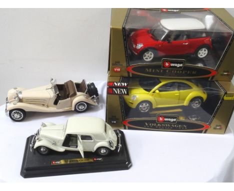 FOUR 'BURAGO' MODEL VEHICLEScomprising a Gold Collection 1/18" scale Volkswagen New Beetle 1998 and Mini Cooper 2000, both wi