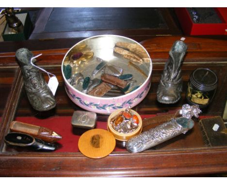 Various collectables, including miniature boots, snuff box in the form of a shoe, etc. 