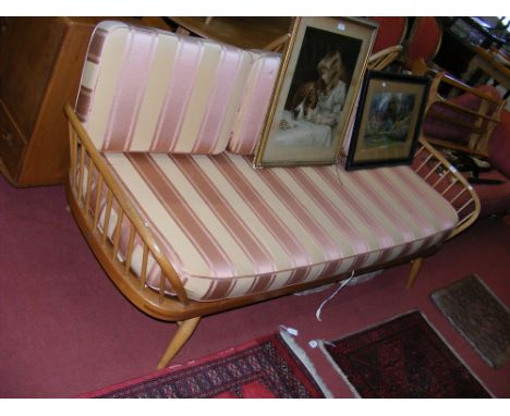 A Retro Ercol three seater settee with panelled backrest 