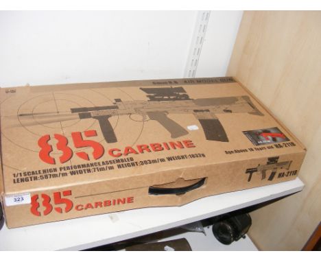 A semi-automatic BB Gun in box 