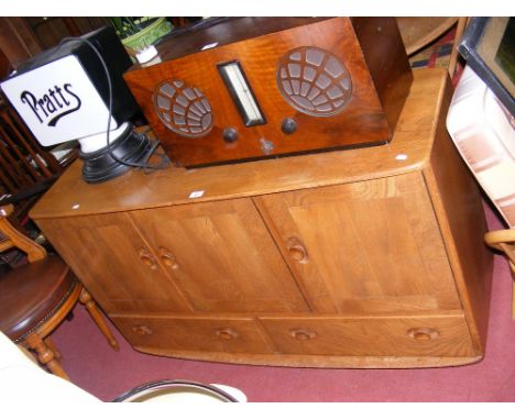 A Retro Ercol sideboard with three doors and two drawers below 