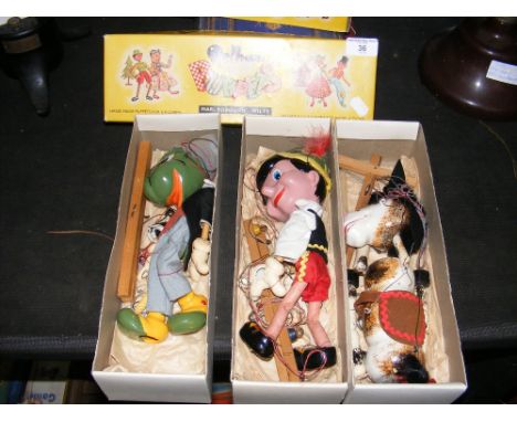 A boxed Pelham Puppet horse, together with two others 