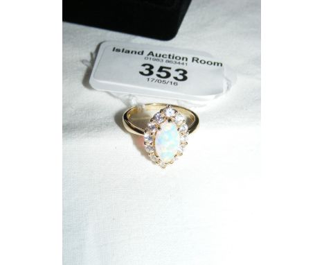 A 14ct gold opal and white stone ring