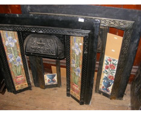 Decorative Victorian cast metal fire surround with tiled side columns and one other 