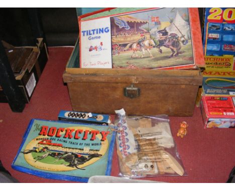 Various boxed children's games enclosed in a metal trunk included