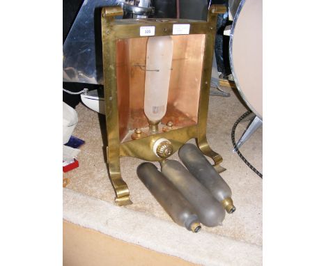 An early carbon bulb heater, circa 1920, in brass surround