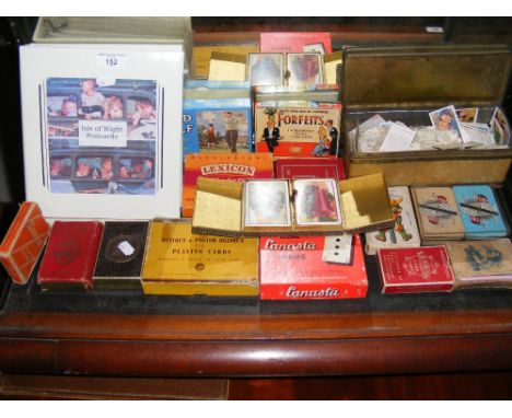 An album containing selection of Isle of Wight postcards, together with cigarette cards, playing cards 