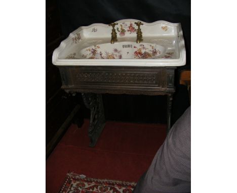 Decorative transfer printed Victorian ceramic sink with brass taps and pierced cast metal stand