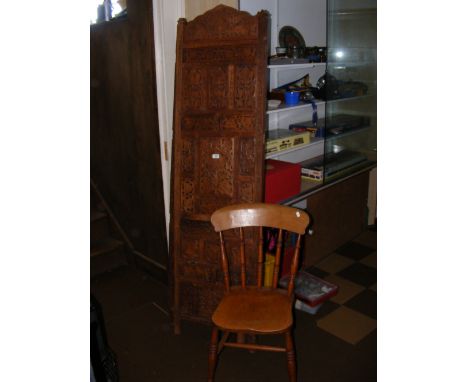 A four-fold carved wooden bedroom screen, together with a stickback chair
