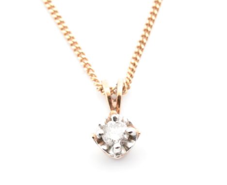 A hallmarked Italian 9ct gold and diamond pendant necklace. The 9ct yellow gold curb link chain necklace strung with a pendan
